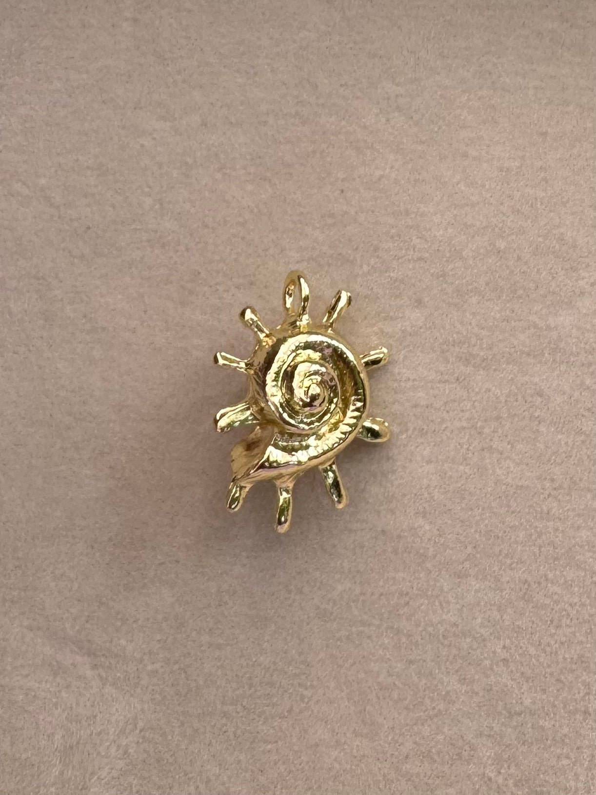 Gold shell burst charm